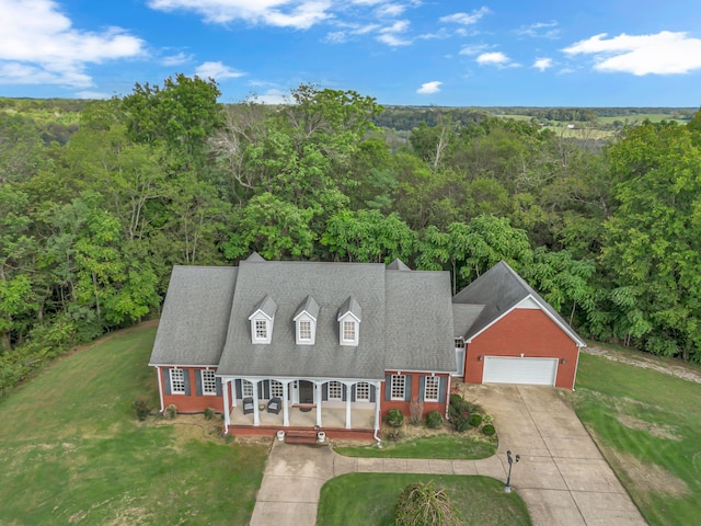 view of front of home with a garage and a front yard