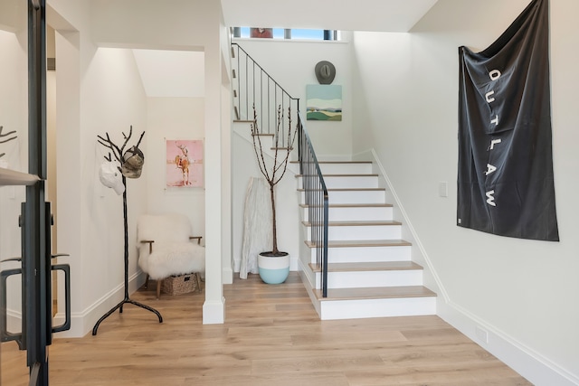 staircase featuring hardwood / wood-style floors