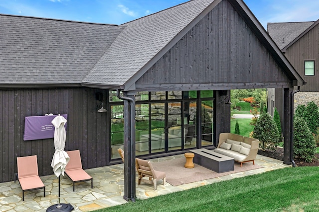 back of property featuring an outdoor living space, a gazebo, and a patio area