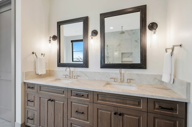 bathroom featuring vanity and tiled shower