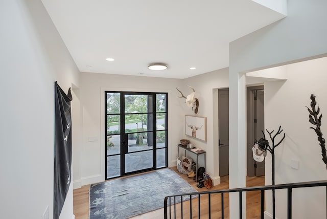 doorway to outside with light hardwood / wood-style floors