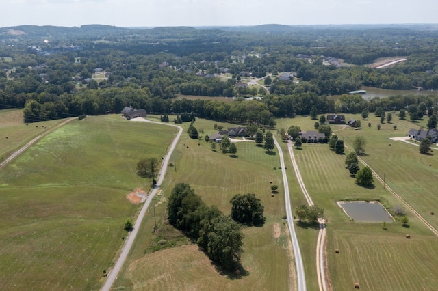 birds eye view of property with a rural view