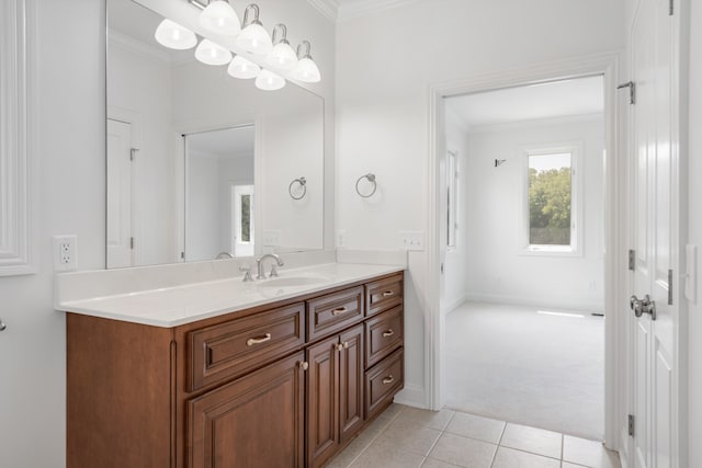 bathroom featuring vanity, ornamental molding, and tile patterned floors