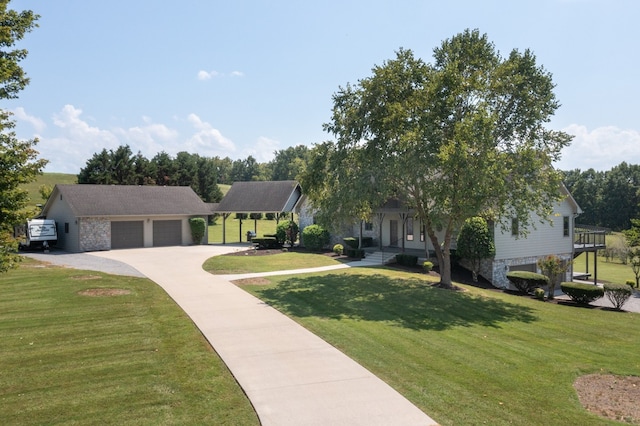 view of front of property with a garage and a front yard