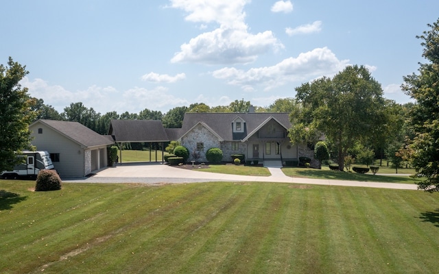 view of front of home featuring a front lawn and a garage