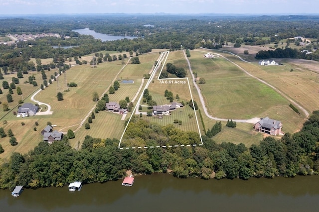 drone / aerial view featuring a rural view and a water view