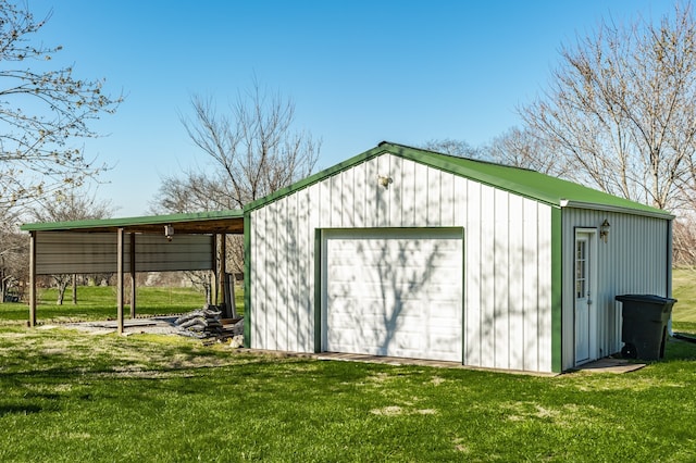 view of outbuilding with a lawn and a garage