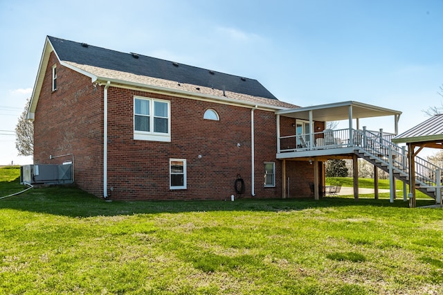 rear view of property with a yard