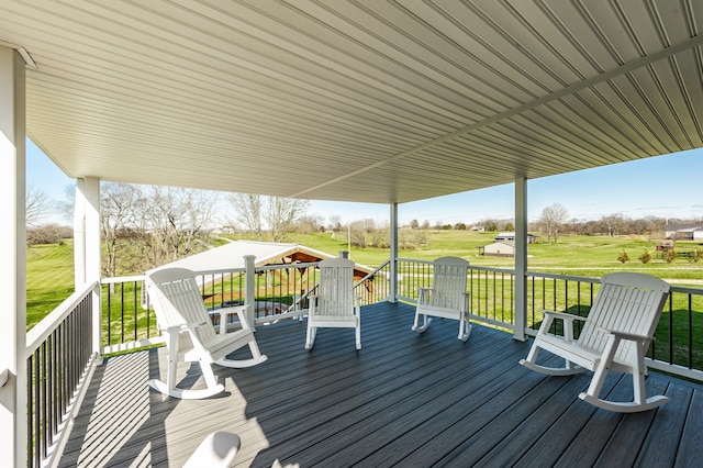 wooden deck with a lawn