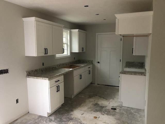 kitchen featuring white cabinets