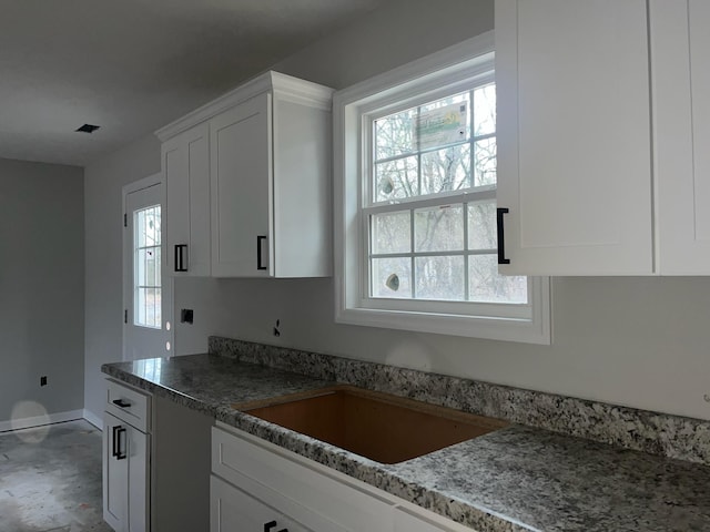 kitchen with white cabinetry