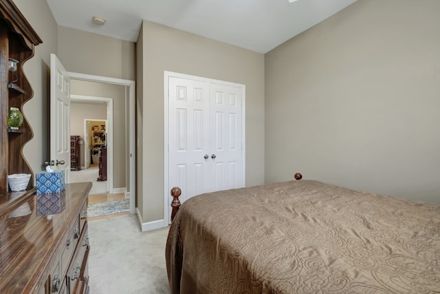 carpeted bedroom with a closet