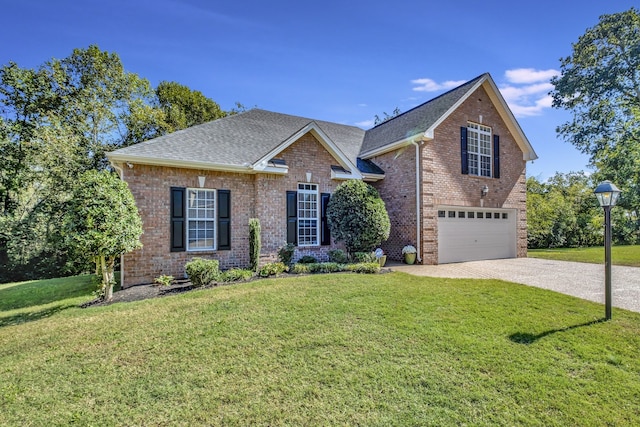 view of front of home with a garage and a front lawn