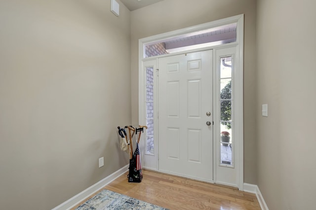 entryway with light hardwood / wood-style floors