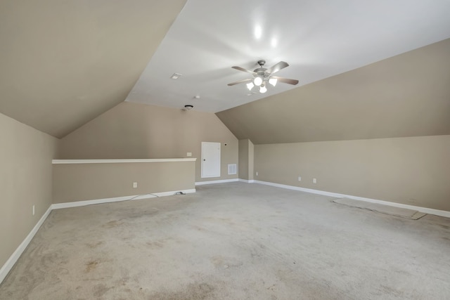 additional living space with carpet floors, vaulted ceiling, and ceiling fan