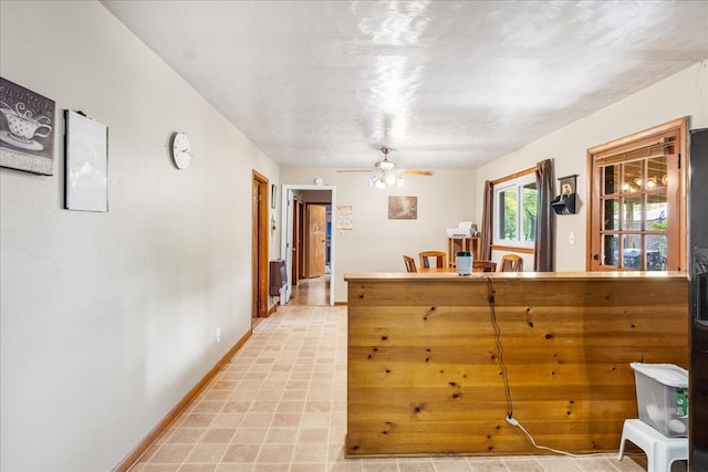 kitchen featuring ceiling fan