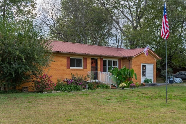 single story home featuring a front yard