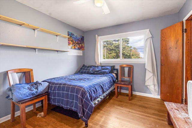 bedroom with hardwood / wood-style flooring and ceiling fan