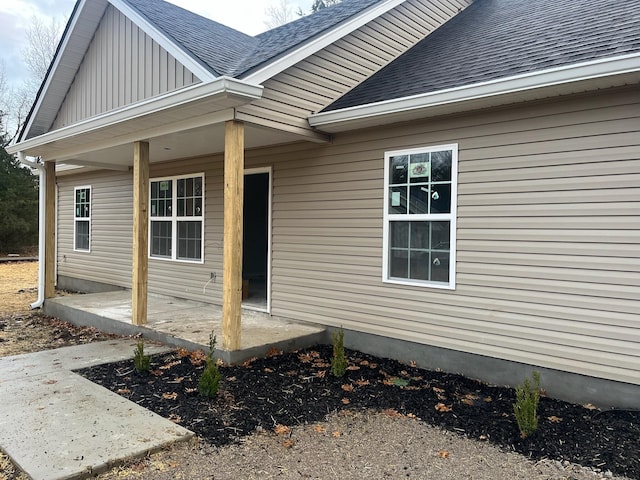 property entrance with covered porch