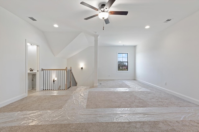 carpeted spare room with lofted ceiling and ceiling fan