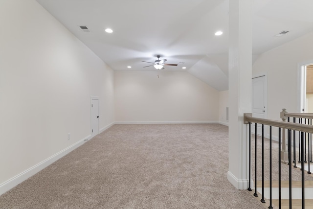 bonus room featuring ceiling fan, vaulted ceiling, and carpet