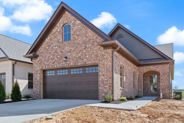 front facade with central AC and a garage