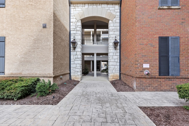 doorway to property featuring a balcony