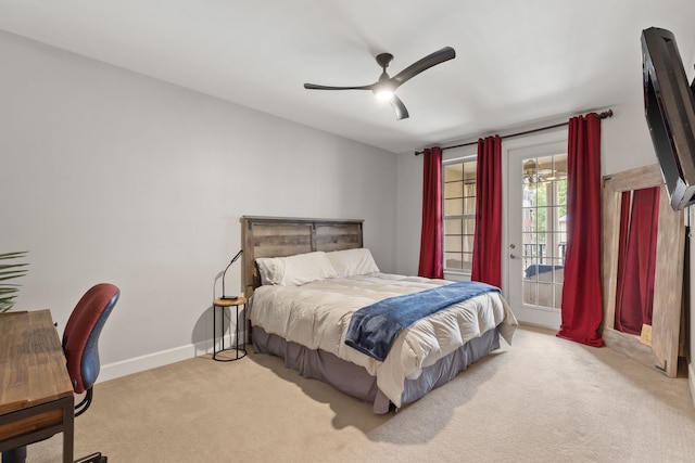 carpeted bedroom featuring access to outside and ceiling fan