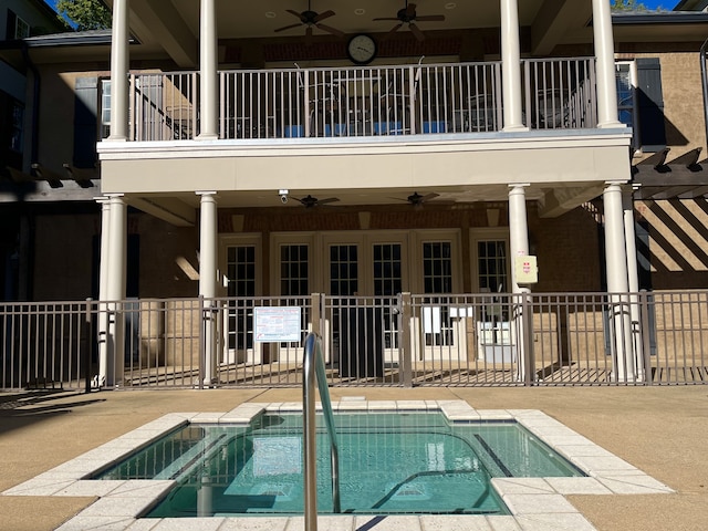 view of swimming pool featuring a patio area and ceiling fan