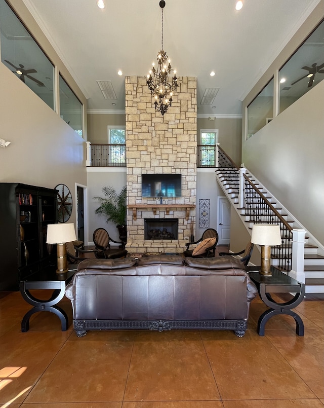 living room with a fireplace, tile patterned flooring, and ornamental molding