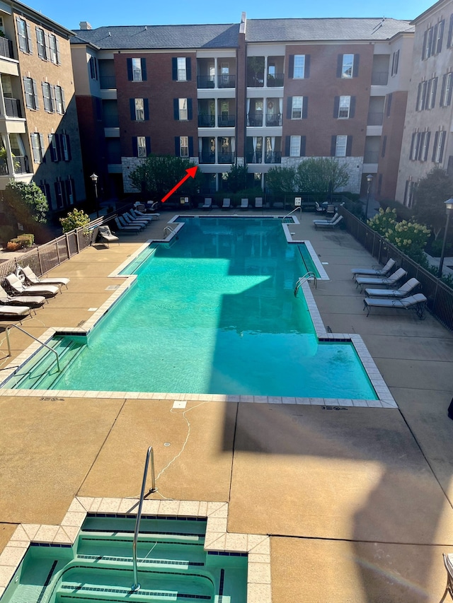 view of swimming pool with a patio area