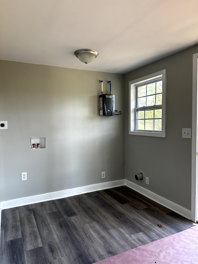 clothes washing area with hookup for a washing machine, water heater, dark hardwood / wood-style floors, and hookup for an electric dryer