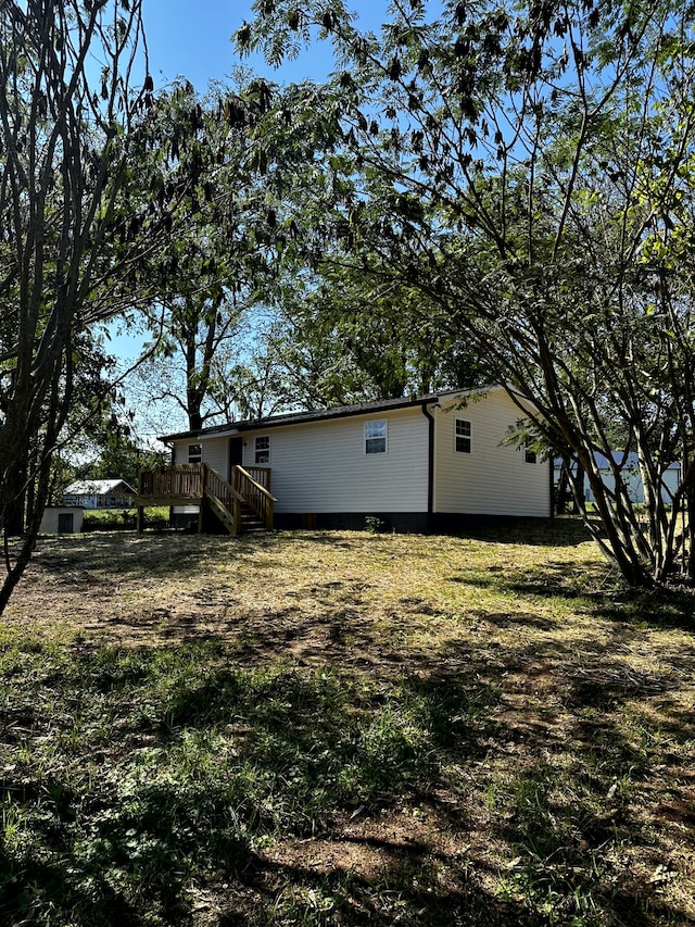 view of yard featuring a wooden deck