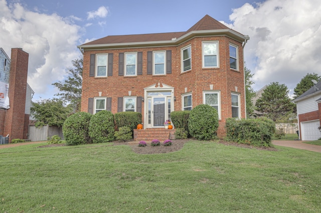 view of front of home with cooling unit and a front yard