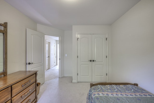 carpeted bedroom featuring a closet