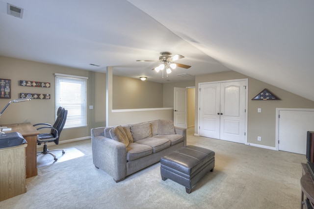 carpeted living room with lofted ceiling and ceiling fan