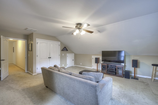 carpeted living room with vaulted ceiling and ceiling fan