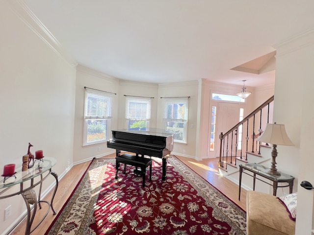 interior space featuring hardwood / wood-style flooring and ornamental molding