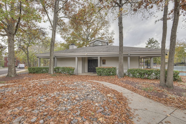 single story home with a porch