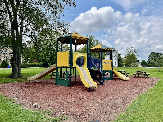 view of jungle gym with a lawn