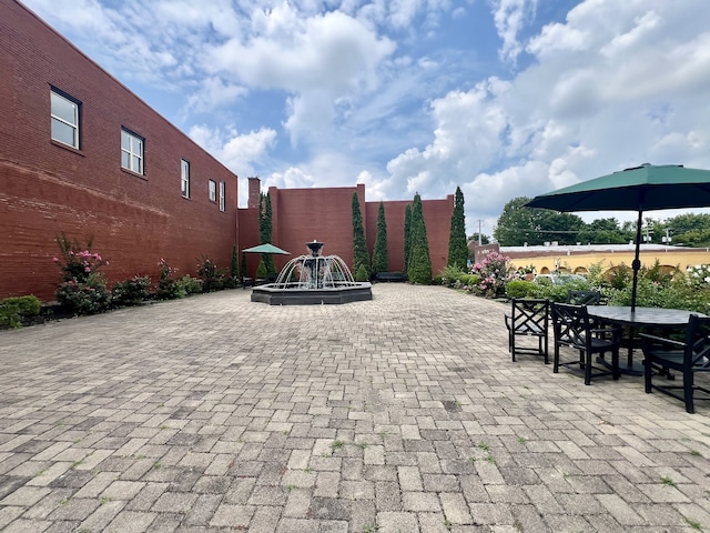 view of patio / terrace featuring an outdoor fire pit