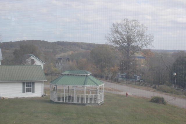 view of yard featuring a gazebo and a mountain view