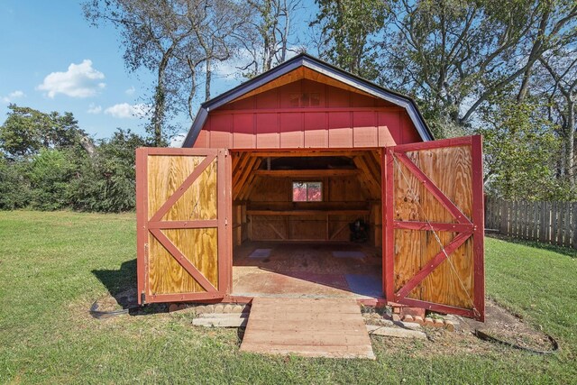 view of shed featuring fence