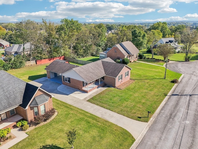 birds eye view of property with a residential view