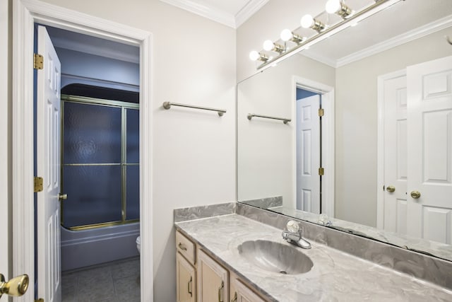 bathroom featuring tile patterned floors, vanity, shower / bath combination with glass door, and ornamental molding