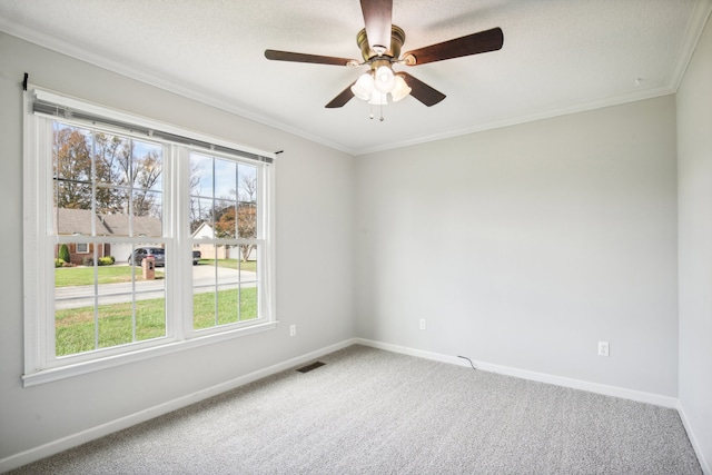 carpeted empty room with a textured ceiling, ceiling fan, and ornamental molding