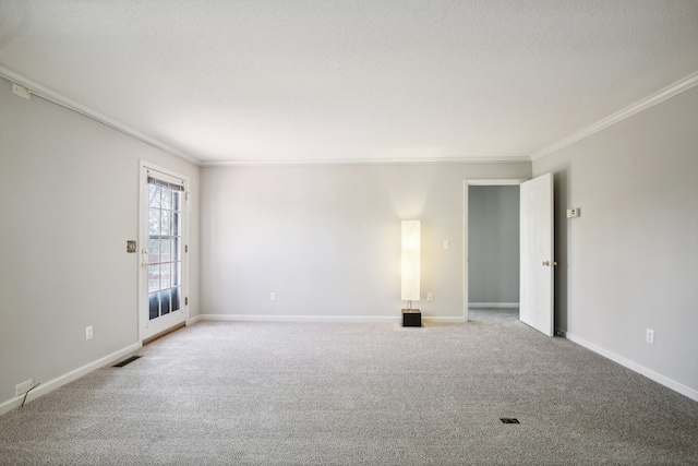 carpeted spare room featuring ornamental molding