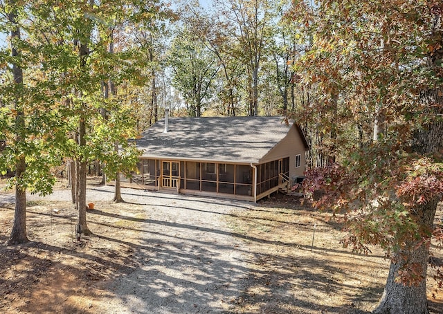 view of front of home featuring a sunroom