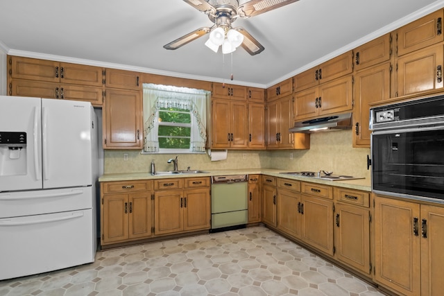 kitchen featuring decorative backsplash, white appliances, crown molding, ceiling fan, and sink