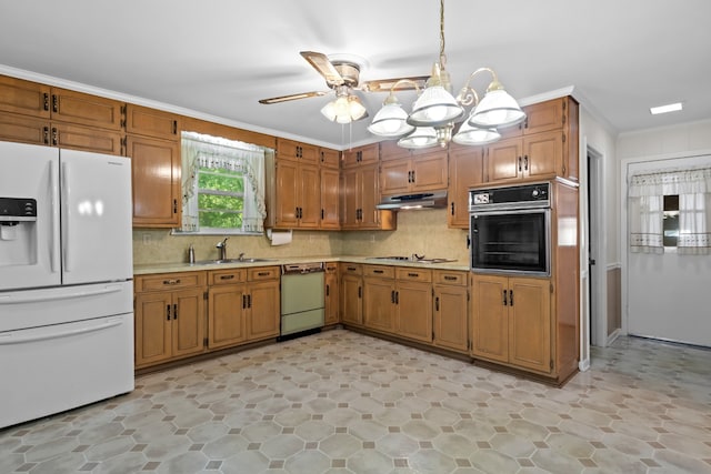 kitchen featuring hanging light fixtures, ceiling fan with notable chandelier, white appliances, ornamental molding, and sink
